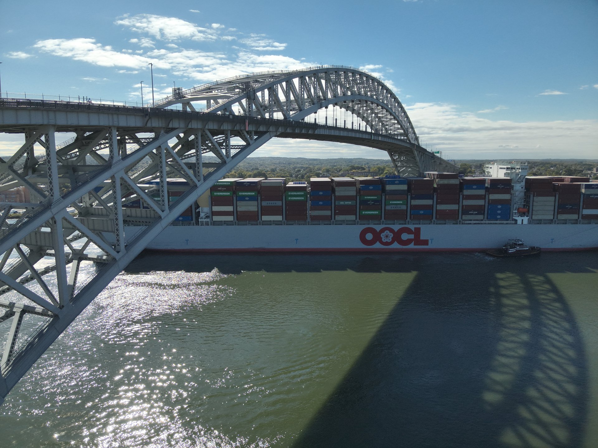 Drone inspection view of container ship passing under Bayonne Bridge